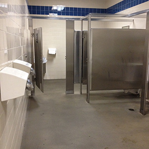 rest area men's restroom stalls and blow dryers